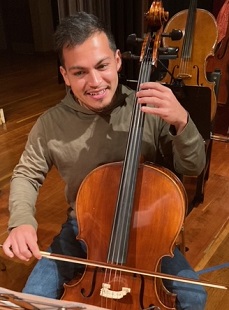 orchestra member playing the cello